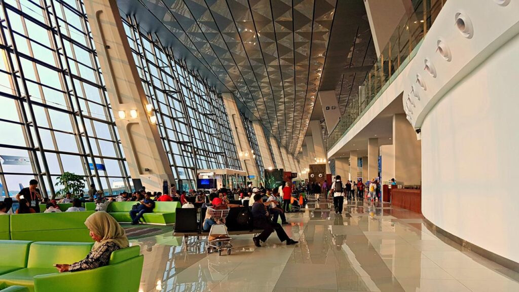 People waiting in Jakarta Airport for Holidays with Airport fee discount